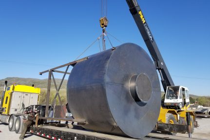 crane loading metal piece