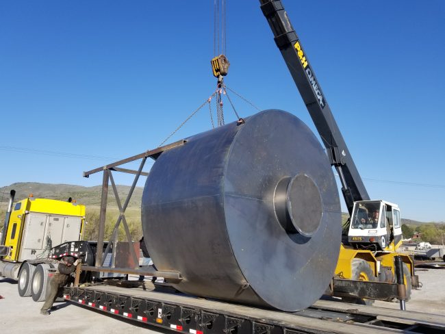 crane loading metal piece