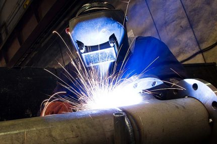 welder wearing hood